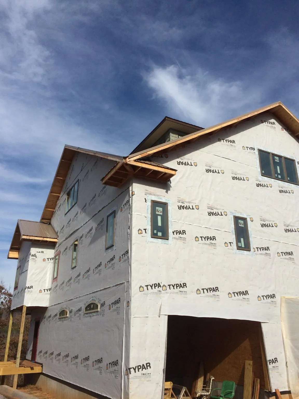 Stick built house wrapped in Typar with new roof framing and dormers in Jefferson